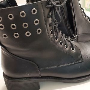 Black booties,  never worn.   Size US 7